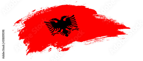 National flag of Albania with curve stain brush stroke effect on white background