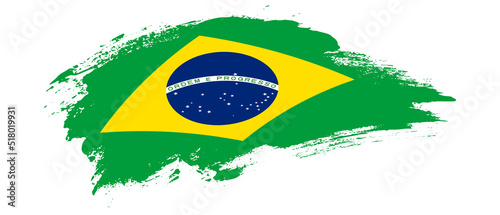 National flag of Brazil with curve stain brush stroke effect on white background