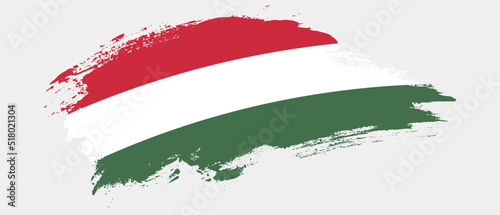 National flag of Hungary with curve stain brush stroke effect on white background