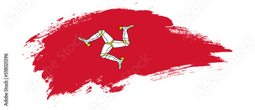 National flag of Isle of Man with curve stain brush stroke effect on white background photo