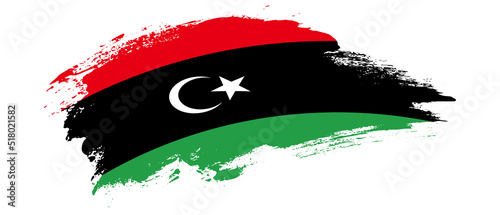 National flag of Libya with curve stain brush stroke effect on white background