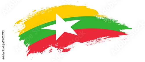 National flag of Myanmar with curve stain brush stroke effect on white background