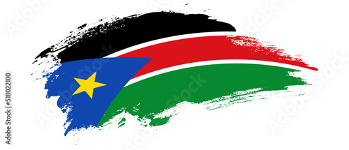 National flag of South Sudan with curve stain brush stroke effect on white background