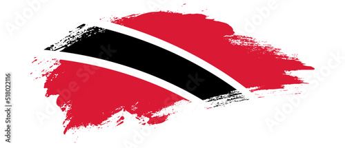 National flag of Trinidad and Tobago with curve stain brush stroke effect on white background photo