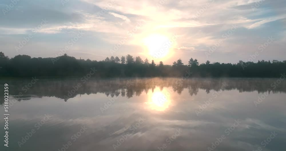 Beautiful Drone shot 4k over lake in Michigan at sunrise. Beautiful Drone shot 4k over lake in Michigan at sunrise.