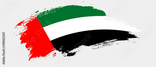 National flag of United Arab Emirates with curve stain brush stroke effect on white background