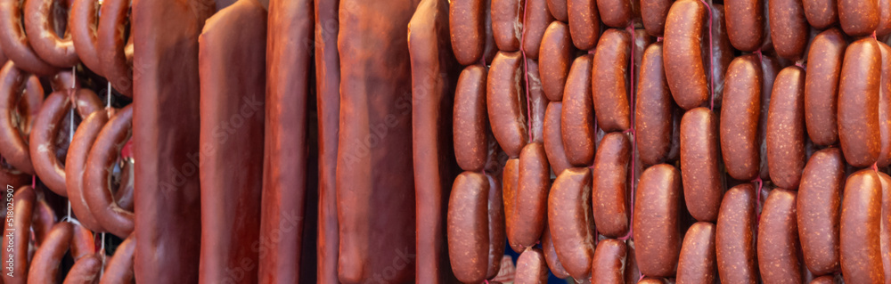 Turkish food bacon (pastirma) hanging on luxury delicatessen counter. traditional appetizer of the month of ramadan. Turkish food bacon (pastirma) hanging on luxury delicatessen counter. traditional appetizer of the month of ramadan.