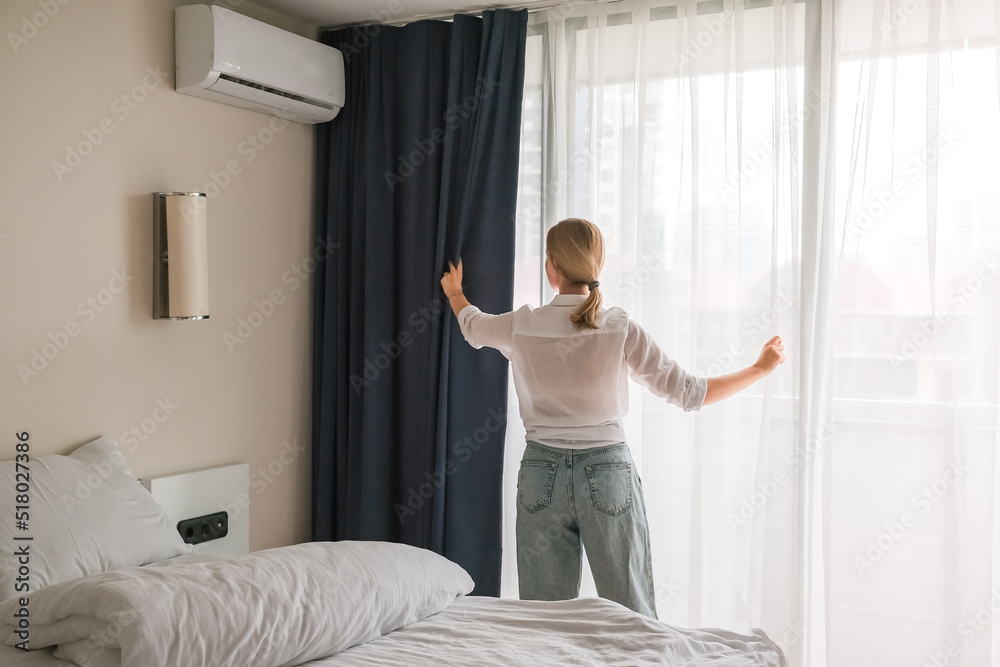 girl cleans the bedroom. Makes the bed after sleep. House cleaning, daily cleaning concept, cleaning service girl cleans the bedroom. Makes the bed after sleep. House cleaning, daily cleaning concept, cleaning service