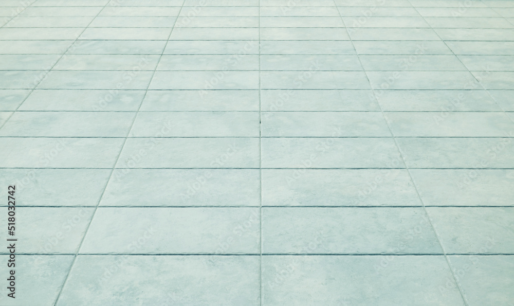 Perspective brick tile floor background. Green stone street road texture. Perspective brick tile floor background. Green stone street road texture.