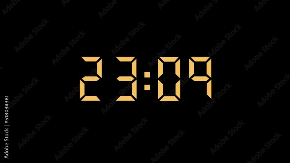 A beautiful glowing dial of an electronic clock shows the midnight time in darkness