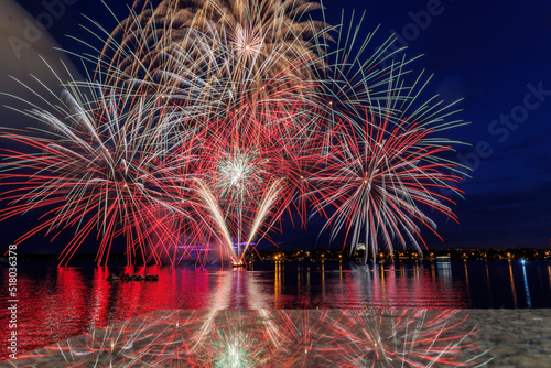 Festive fireworks on the city pond on the Day of the metallurgist in Nizhny Tagil. photo