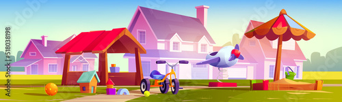 Kids playground at suburb with cottages, children area with sandbox, toys, bicycle and wooden house for playing and recreation fun. Park, garden or yard, kindergarten field Cartoon vector illustration photo
