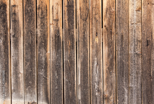 Wooden surface as background texture with rays of light.