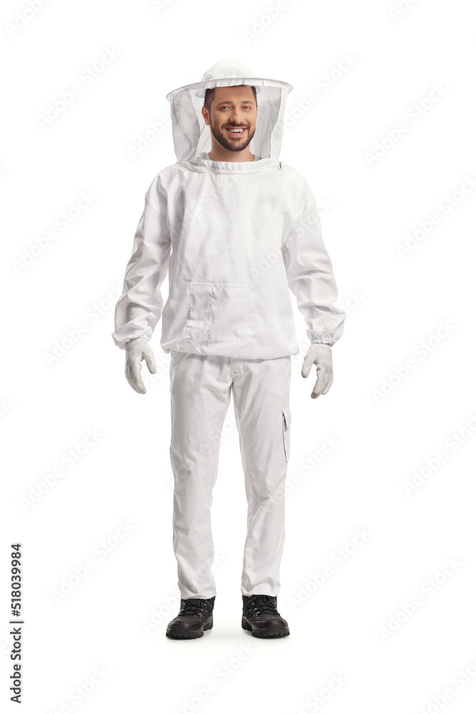 Full length portrait of a young male bee keeper in a uniform Full length portrait of a young male bee keeper in a uniform