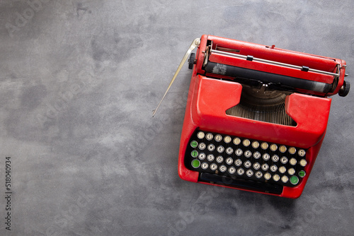 Fotografi Journalism or blogging concept - vintage typewriter on the grey desk, top view