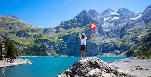 young boy and swiss flag ( Oeschinen lake,  Kandersteg) photo