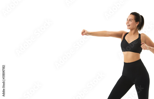 Perfect slim tanned young female body in sportswear. Concept perfect body, no fat, motivation, healthy lifestyle, fitness routine. Isolated white background.