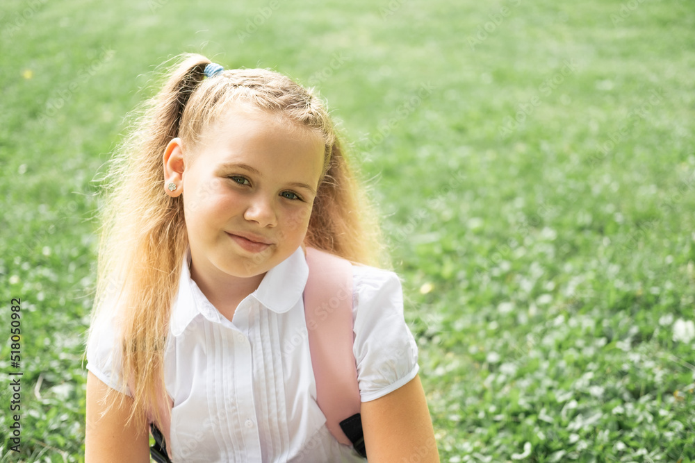 close up portrait of smiling blonde schoolgirl in white shirt with pink backpack back to school outdoor close up portrait of smiling blonde schoolgirl in white shirt with pink backpack back to school outdoor