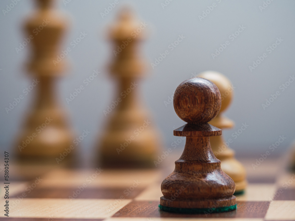 Wooden chess pawn with King and Queen desfocused. Intellectual fight concept Wooden chess pawn with King and Queen desfocused. Intellectual fight concept