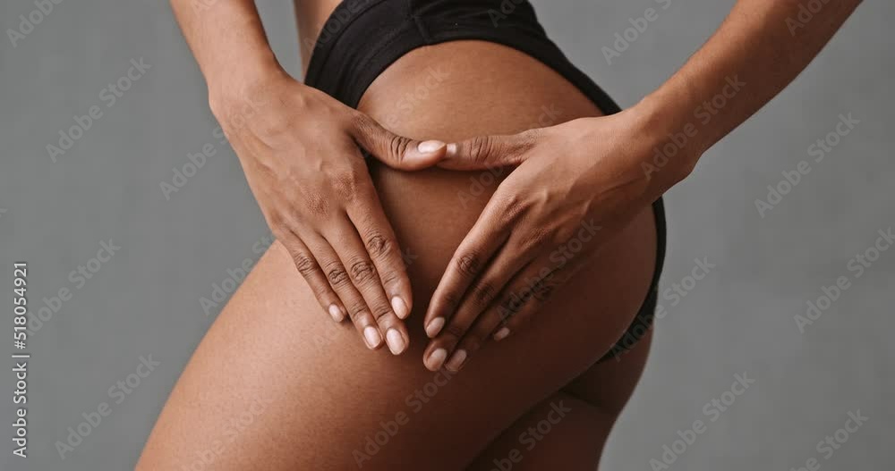 Close up mixed race female making heart shape on her thigh