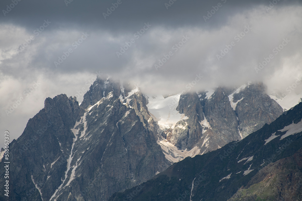 Clouds over the mountains. Amazing high rocks in the fog. Clouds over the mountains. Amazing high rocks in the fog.