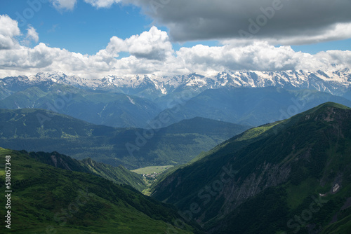 Beautiful mountains landscape. Panoramic view on the green hills and mountains under clouds . © Inga Av