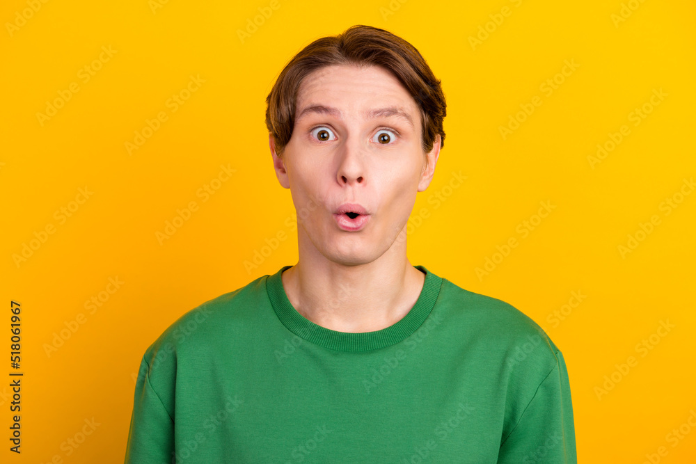 Photo of amazed young man open mouth unbelievable information isolated on vibrant color background