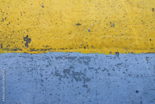 Corroded iron background, in yellow and blue colors. It can be used as a ukrainian flag or a background with abstract expression. 