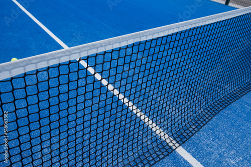blue paddle tennis court netting, racket sports concept