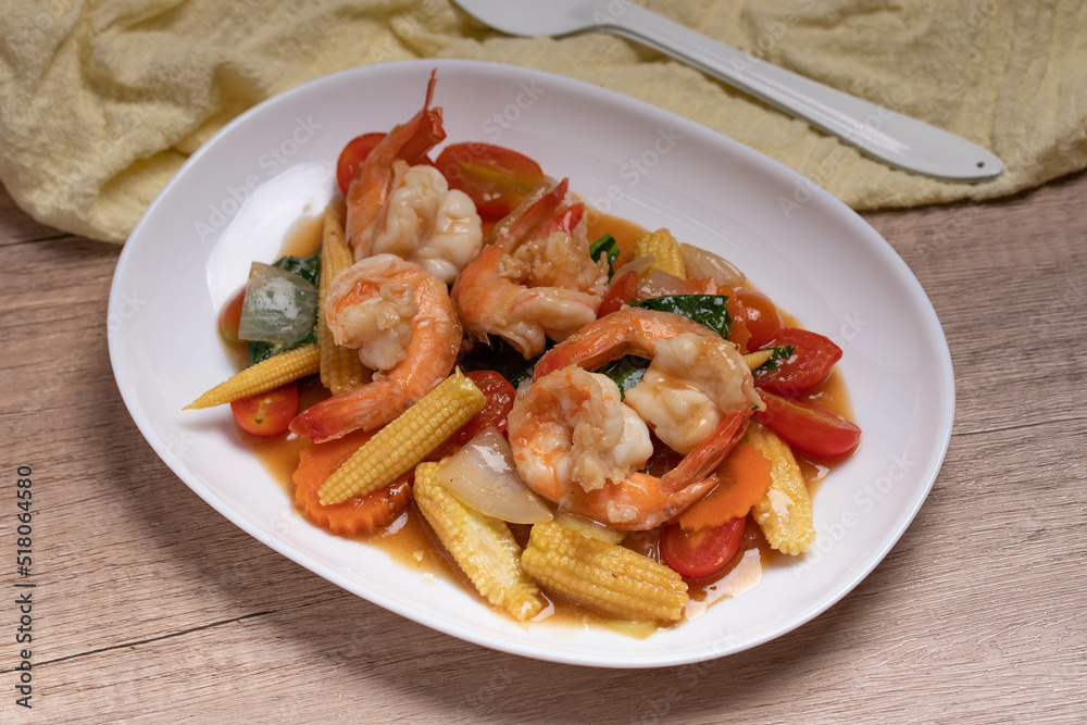 Stir-fried mixed vegetables with shrimp. In a white plate, healthy food concept. Stir-fried mixed vegetables with shrimp. In a white plate, healthy food concept.