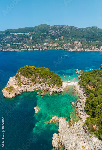 Aerial view of Limni Beach Glyko, on the island of Corfu. Greece. Where the two beaches are connected to the mainland providing a wonderful scenery. Unique double beach. Kerkyra