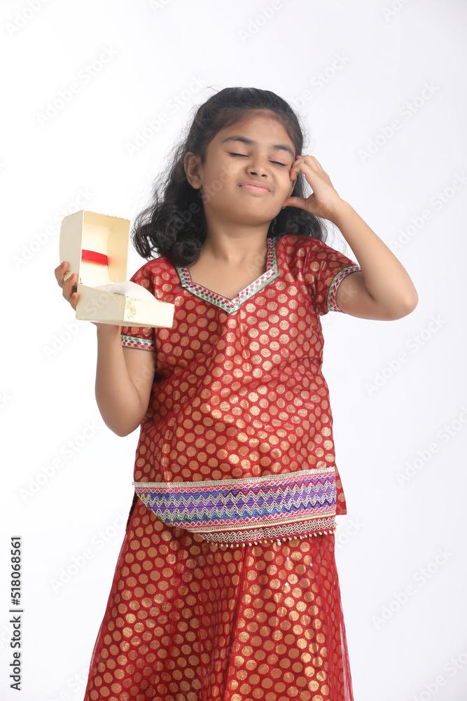 Indian little girl recieved gift and thinking some idea Indian little girl recieved gift and thinking some idea