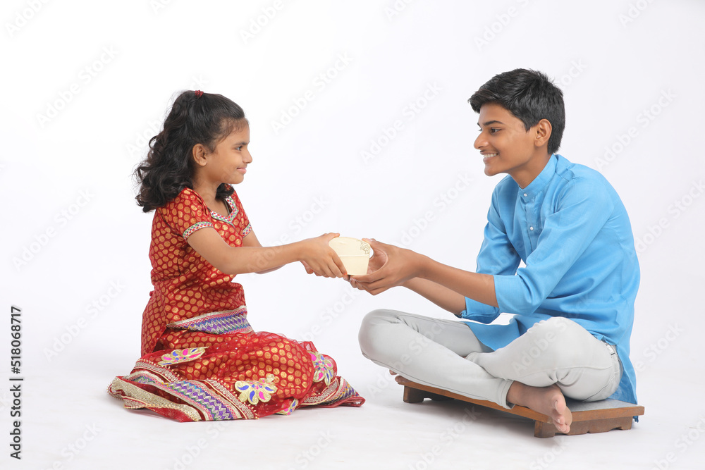 Brother giving gift to her sister on the occasion of Raksha Bandhan Stock  Photo - Alamy