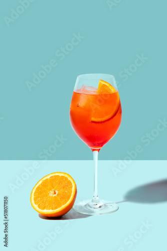 Spritz Veneziano cocktail with orange on blue background