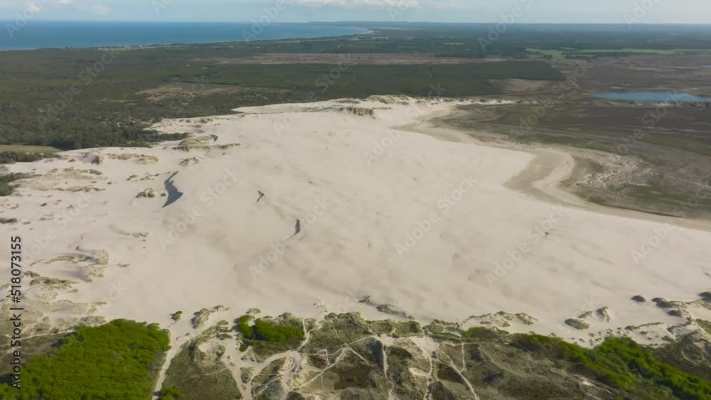 Aerial view of large sand dunes in the middle of Denmark's forest. Aerial view of large sand dunes in the middle of Denmark's forest.