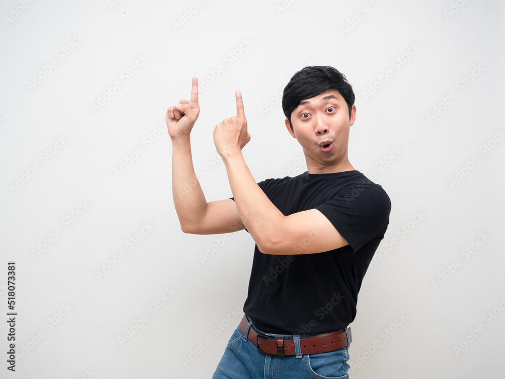 Man black shirt feels amazed point finger above isolated Man black shirt feels amazed point finger above isolated