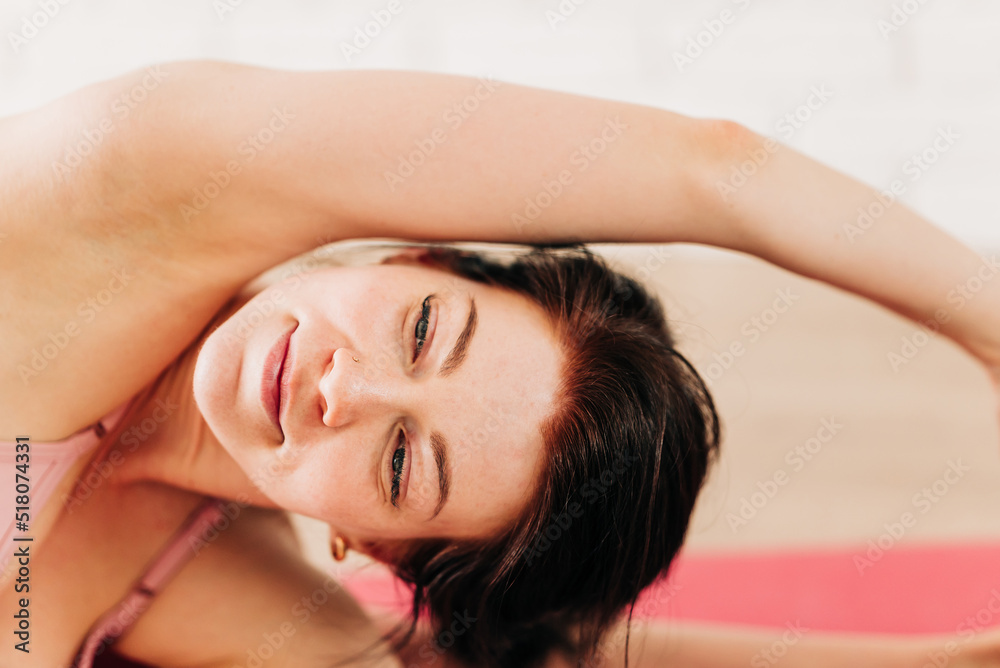 Fit woman in sportswear doing workout yoga burning fat calories training strength practicing effort domestic fitness females aerobics sport fit at home Fit woman in sportswear doing workout yoga burning fat calories training strength practicing effort domestic fitness females aerobics sport fit at home