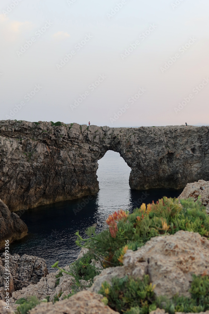 Pont d'en Gil at sunset. Famous Pont d'en Gil at the west coast of Menorca (Minorca), Balearic Islands, Spain.
