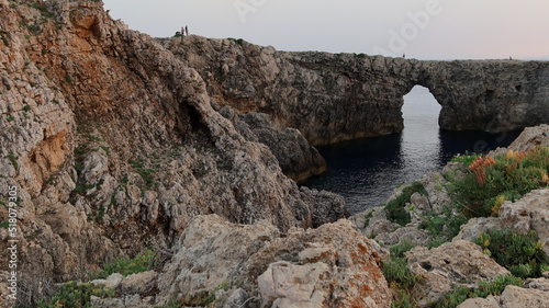 Pont d en Gil at sunset. Famous Pont d en Gil at the west coast of Menorca  Minorca   Balearic Islands  Spain. 