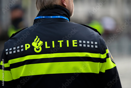 Logo On The Backside Of A Policeman At Amsterdam The Netherlands 2019