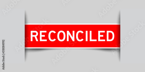 Red color square label sticker with word reconciled that inserted in gray background