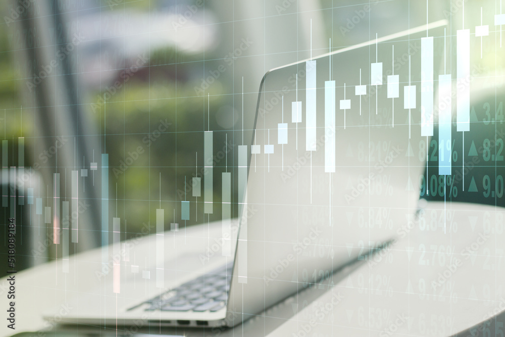 Abstract creative financial graph on modern laptop background, financial and trading concept. Multiexposure Abstract creative financial graph on modern laptop background, financial and trading concept. Multiexposure