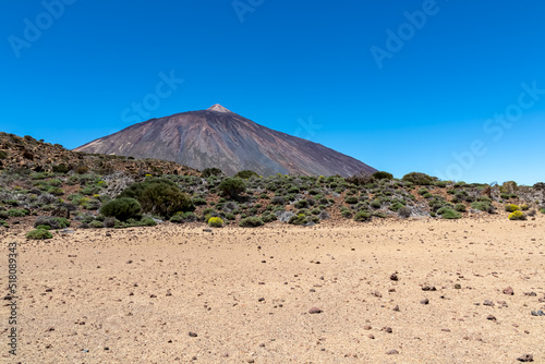 La Canada de los Guancheros dry desert plain with scenic view on volcano Pico del Teide  Mount El Teide National Park  Tenerife  Canary Islands  Spain  Europe. Hiking trail to Riscos de la Fortaleza