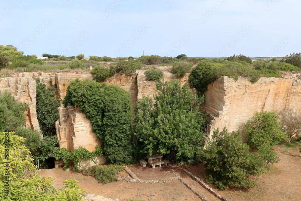 Fototapeta premium Lithica, Pedreres de s'Hostal, Menorca (Minorca) island, Spain. The sandstone quarries overgrown by trees and vegetation with labirynths and gardens