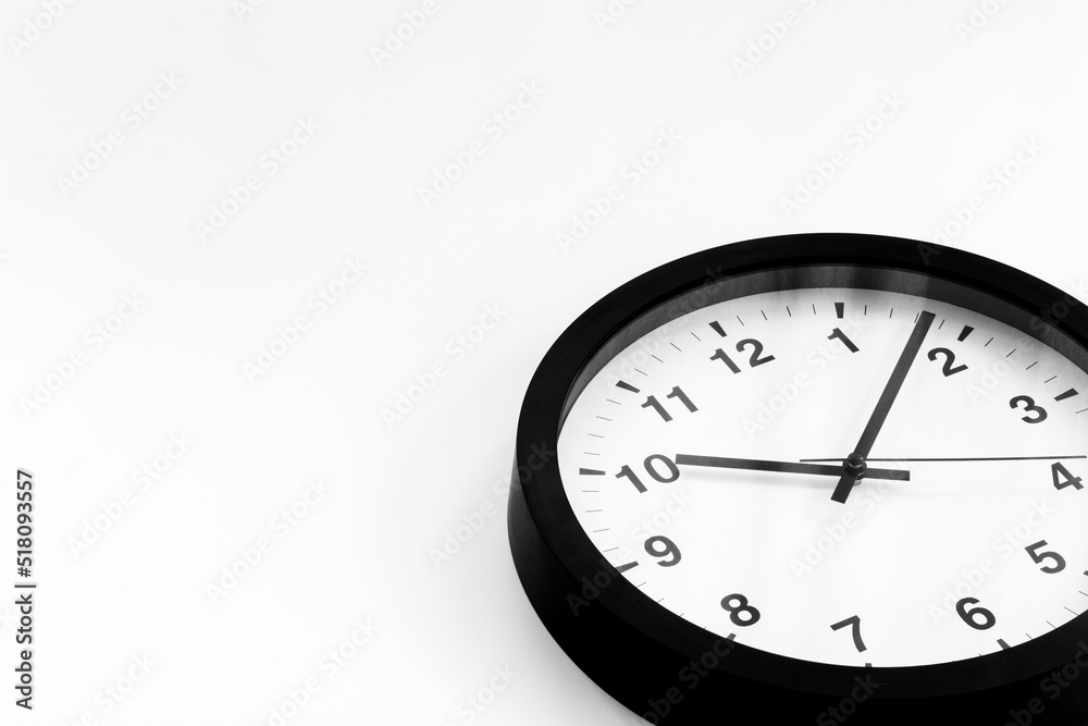 Black and white clock. Round wall clock - time to work concept Black and white clock. Round wall clock - time to work concept