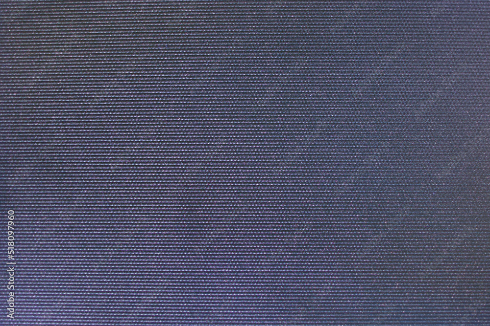 The texture of jeans for the background. View from above. Seamless fabric with jeans texture. The texture of jeans for the background. View from above. Seamless fabric with jeans texture.