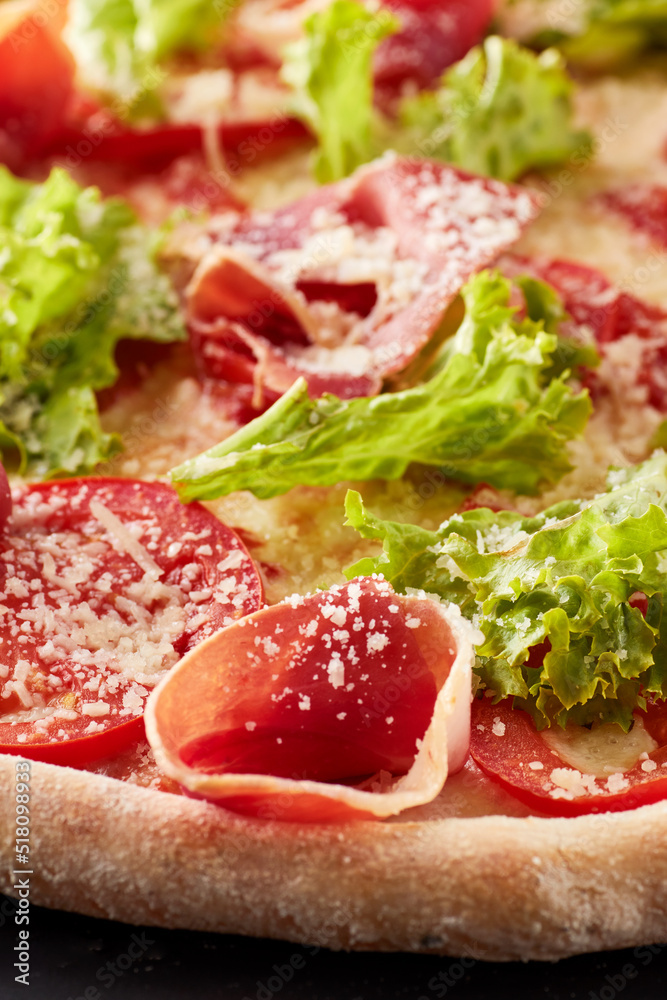 Pizza with prosciutto, lettuce salad and parmesan. Pizza with prosciutto, lettuce salad and parmesan.