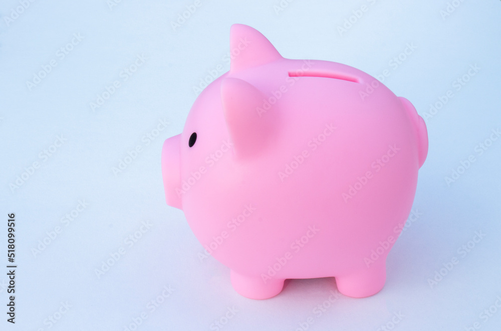Piggy bank on the table. Money saving concept.