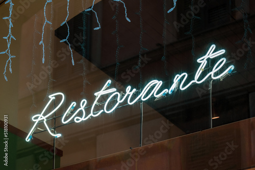 Neon sign Restorante (Restaurant in English) design template neon sign, light banner, neon signboard, nightly bright advertising, light inscription. Vector illustration.  photo