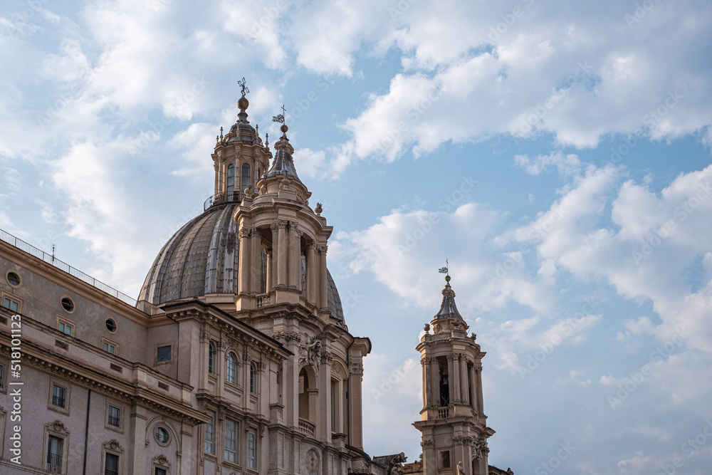 Impressive view of church (Chiesa di Sant 'Agnese) in Rome with blue cloudy sky in background.